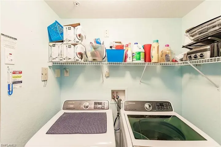 Laundry room featuring washer and clothes dryer