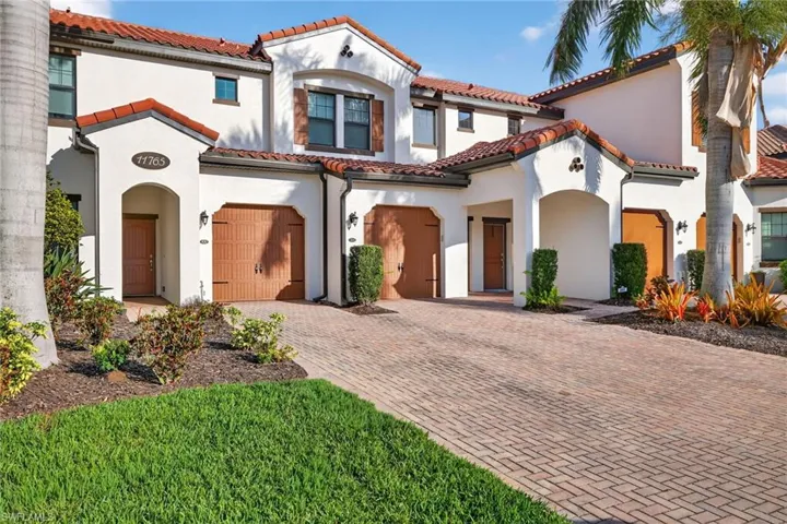 Mediterranean / spanish home featuring stucco siding and a tile roof