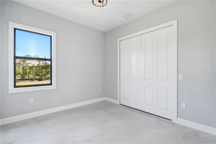 Unfurnished bedroom featuring a closet