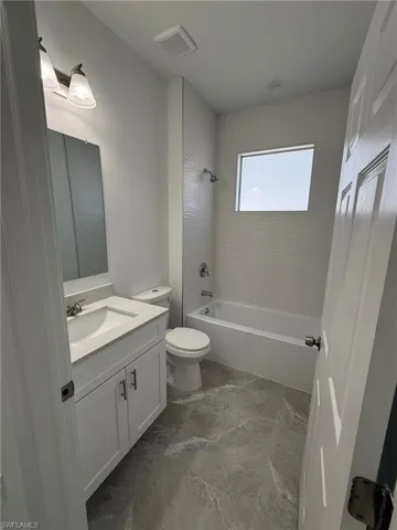 Full bathroom with vanity and  shower combination