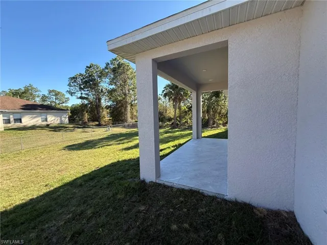 Fenced backyard featuring a patio