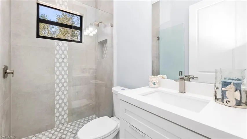 Full bath with vanity and a walk in shower