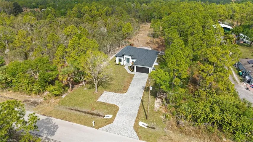 View from above of property with a forest