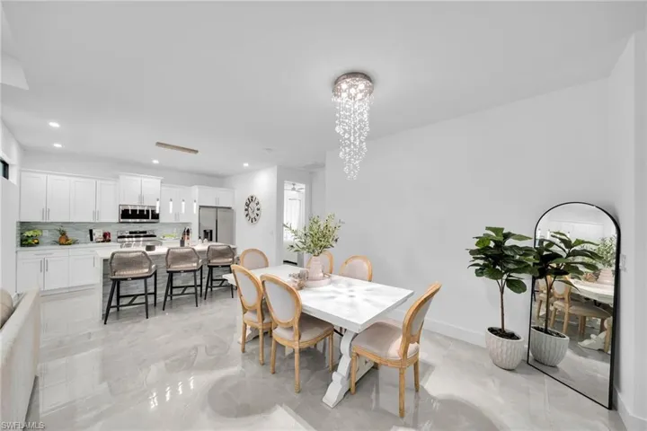 Dining area featuring recessed lighting