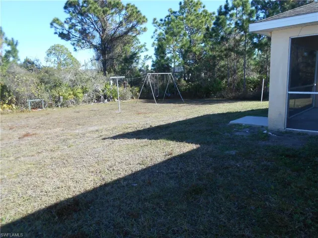 View of green lawn with a playground