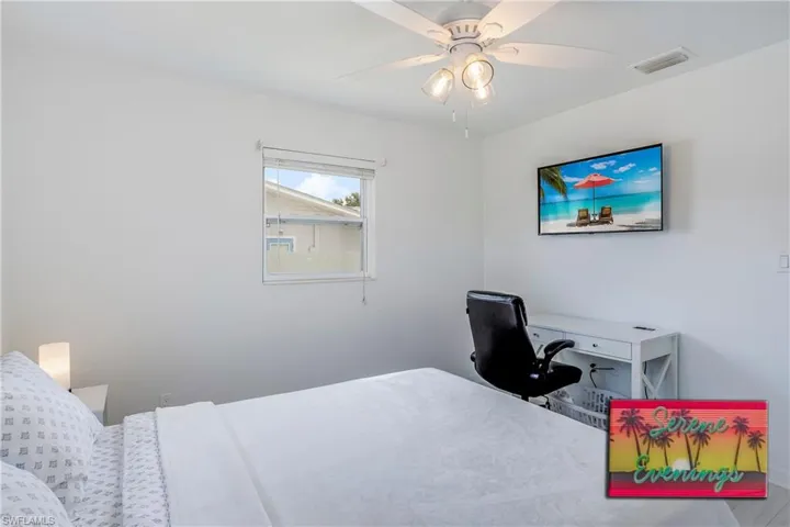 Bedroom featuring a desk and ceiling fan