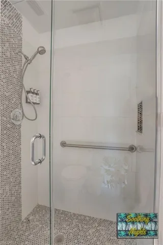 Full bath with a shower stall