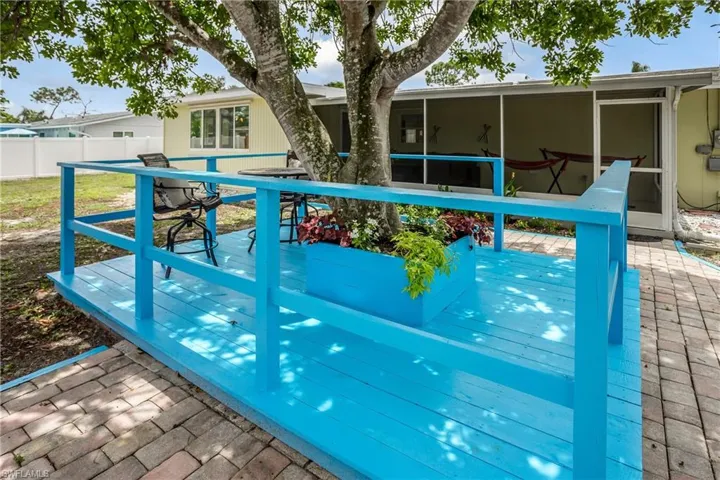 View of pool with a wooden deck