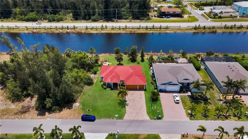 Aerial view of residential area with a nearby body of water
