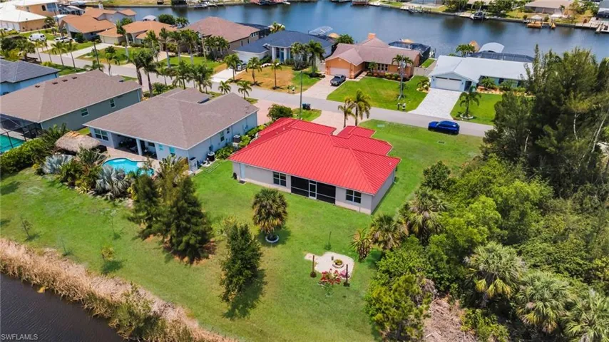 Aerial view of residential area with a nearby body of water