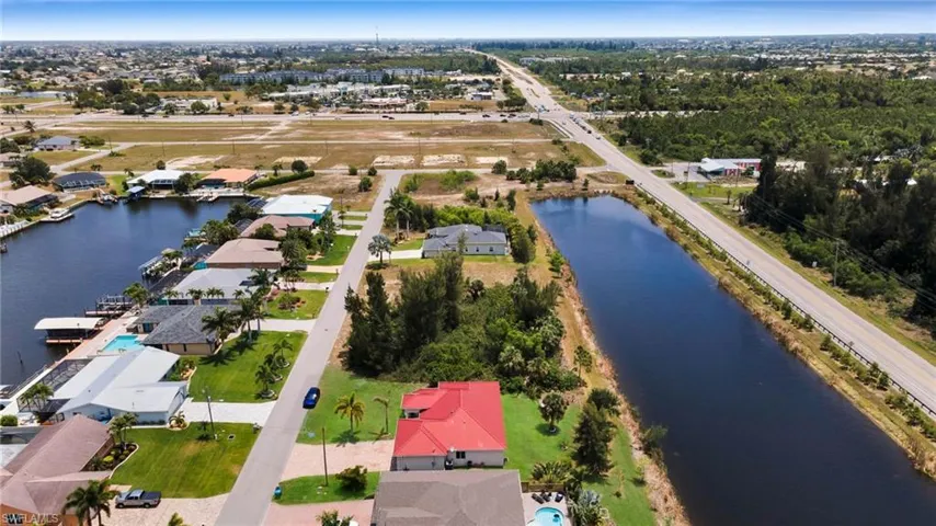 Aerial perspective of suburban area with a large body of water