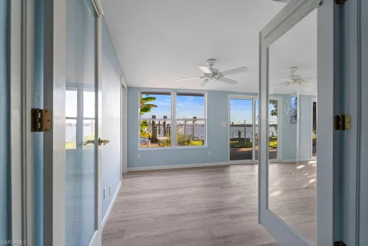 French Doors lead out to the den from the bedroom