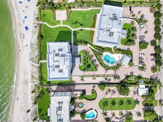 Aerial view of property and surrounding area with a pool