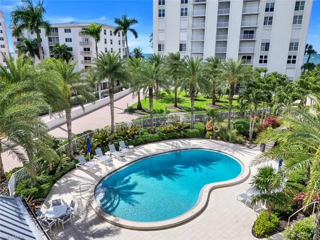 Community pool featuring a patio area