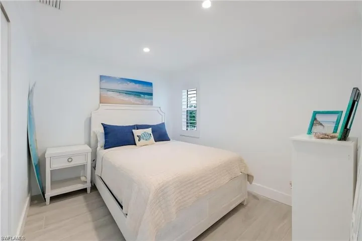 Bedroom with light wood-style flooring and recessed lighting
