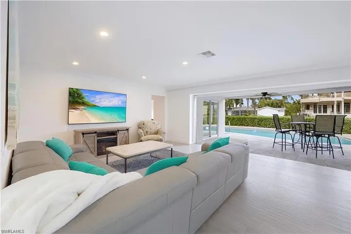 Living area with recessed lighting and wood finished floors