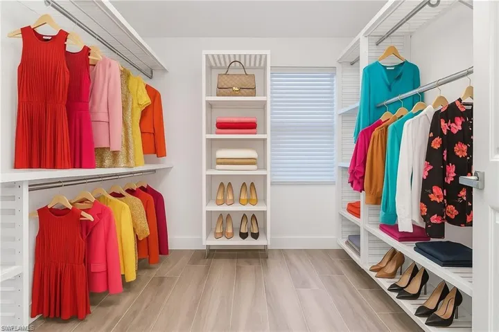 Spacious closet with wood tiled floors