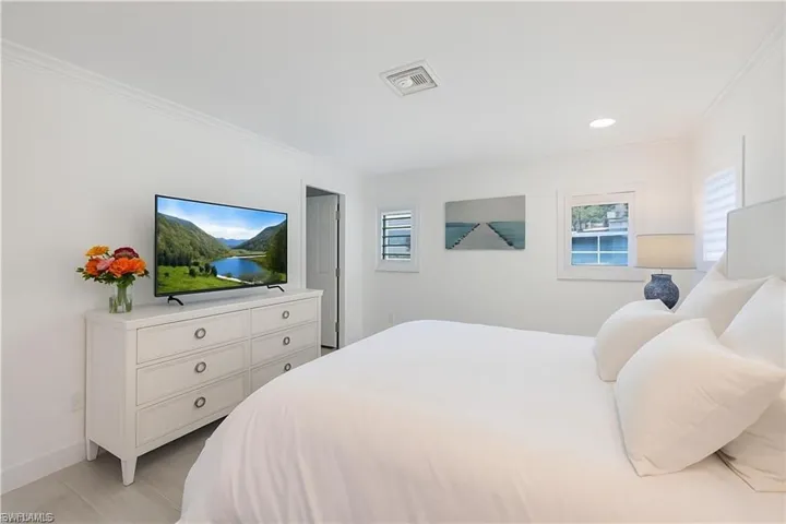 Bedroom featuring ornamental molding and recessed lighting
