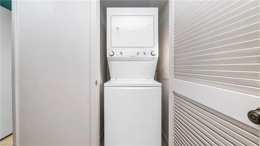 Laundry room with estacked washer and dryer