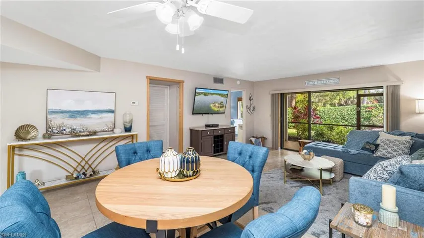 Dining room with light tile patterned floors