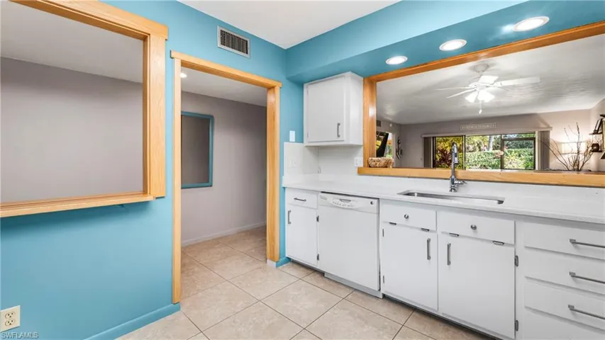 Kitchen with white cabinetry.