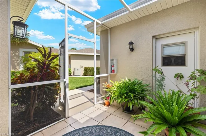 Spacious screened entry has a door to garage