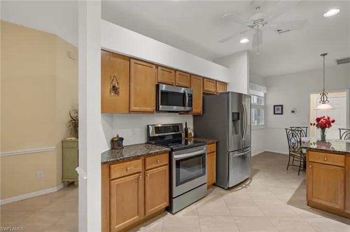 Kitchen with ample counter space, undermount sink and decorative backsplash