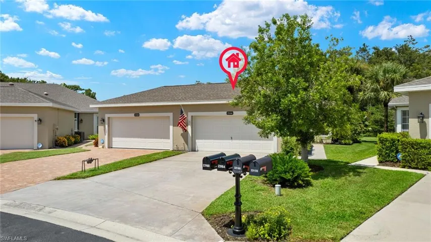 Marsh Landing Villa with a garage and a front yard