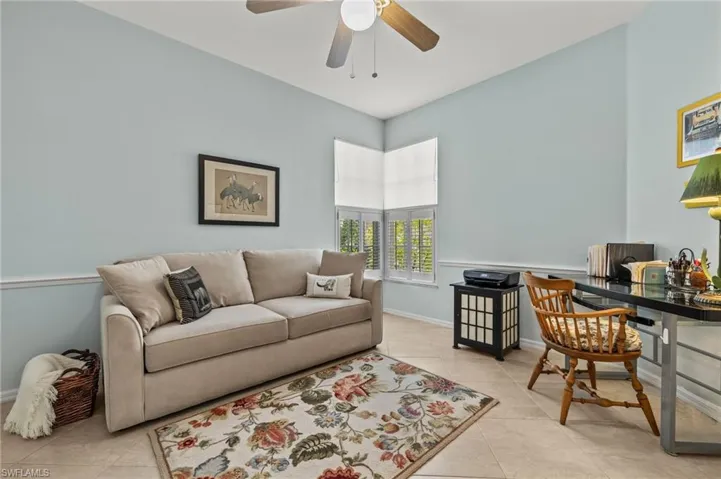 Den with bright corner windows