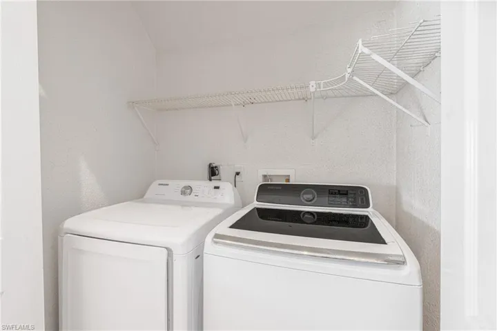 Laundry area featuring washer and clothes dryer