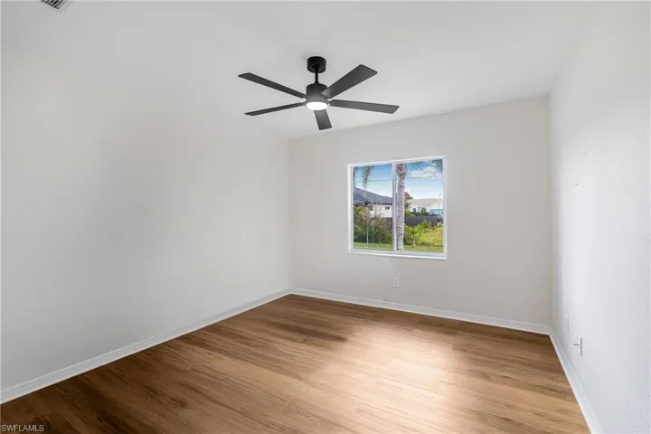 Spare room featuring light hardwood / wood-style floors and ceiling fan