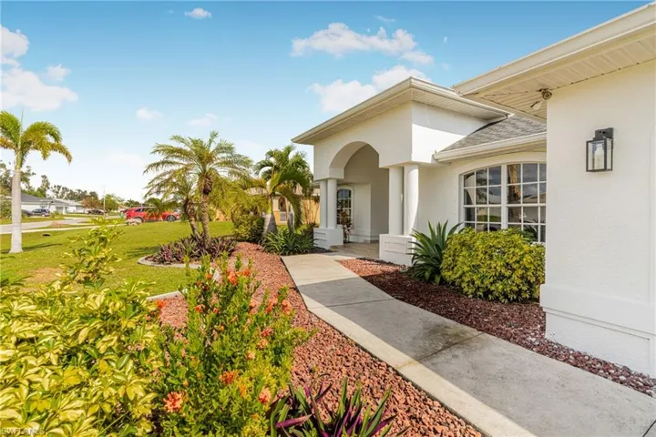 Property entrance with a lawn