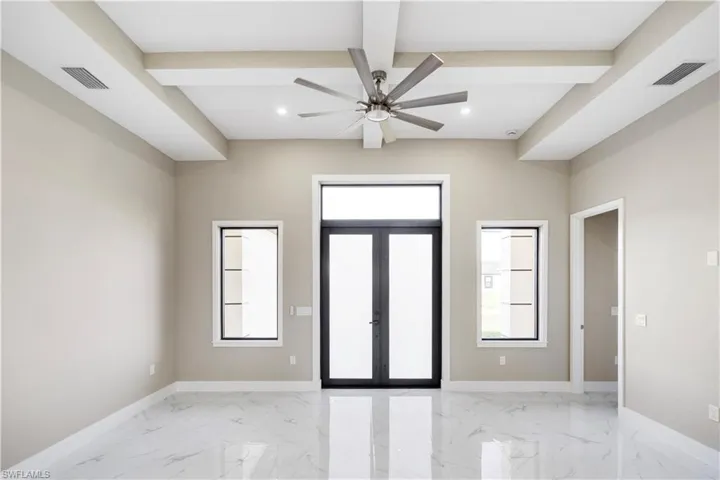 Foyer entrance featuring french doors, ceiling fan, recessed lighting, light marble finish floors, and coffered ceiling