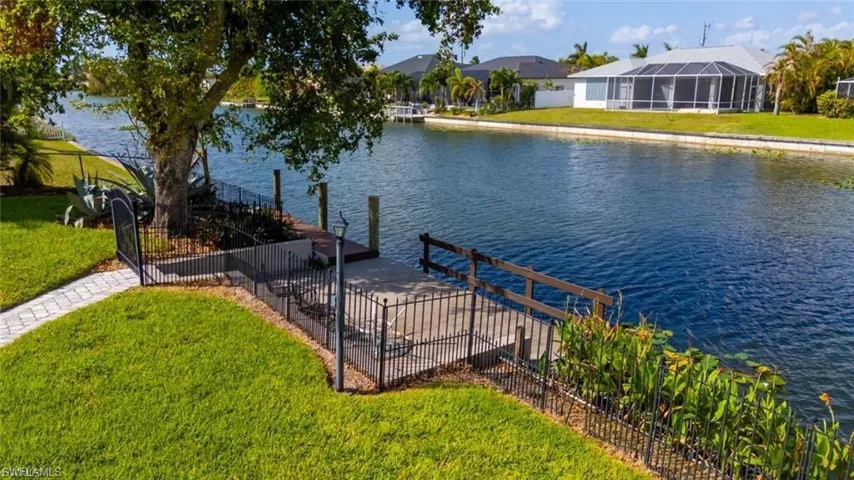 Dock area featuring a water view
