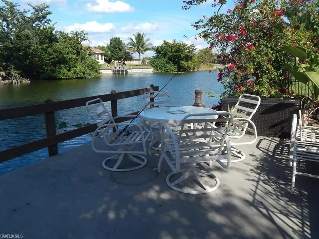 Dock area featuring a water view