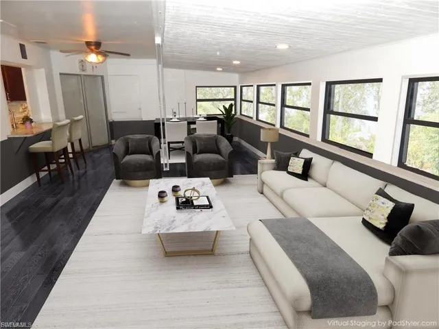 Living room featuring wood finished floors and recessed lighting