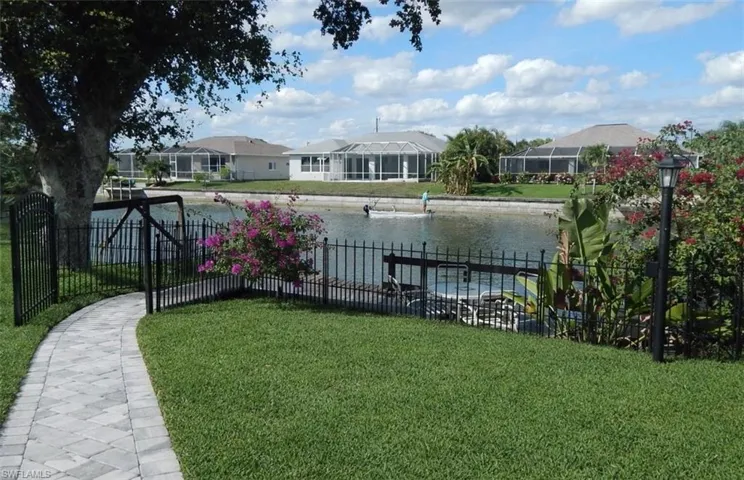View of yard featuring a gate and a water view