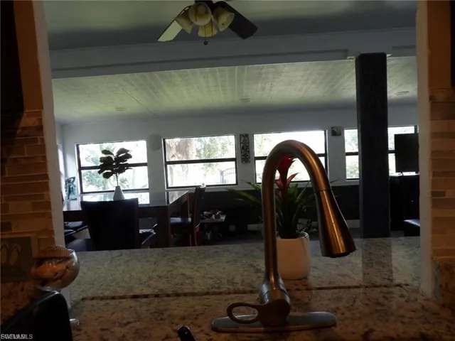 Living area featuring ceiling fan