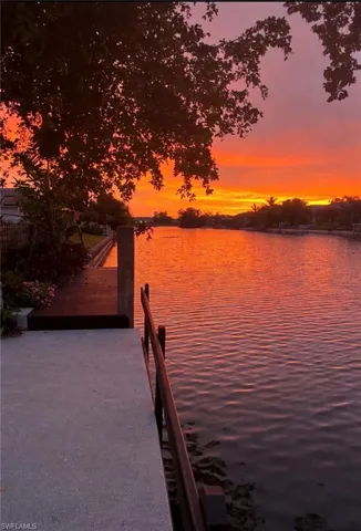 Dock area featuring a water view