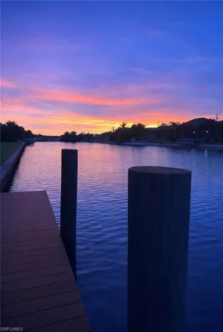 Dock area featuring a water view