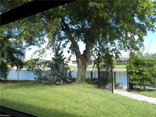 View of yard featuring a gate and a water view