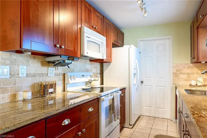 Kitchen with door to laundry and carport entrance