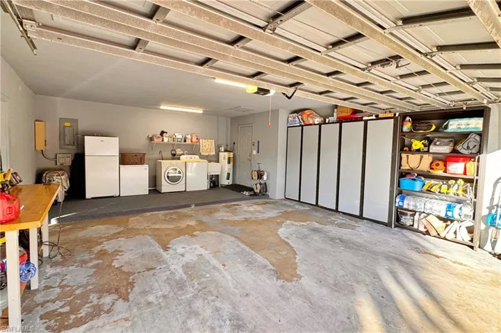 Living room with ceiling fan and light colored carpet