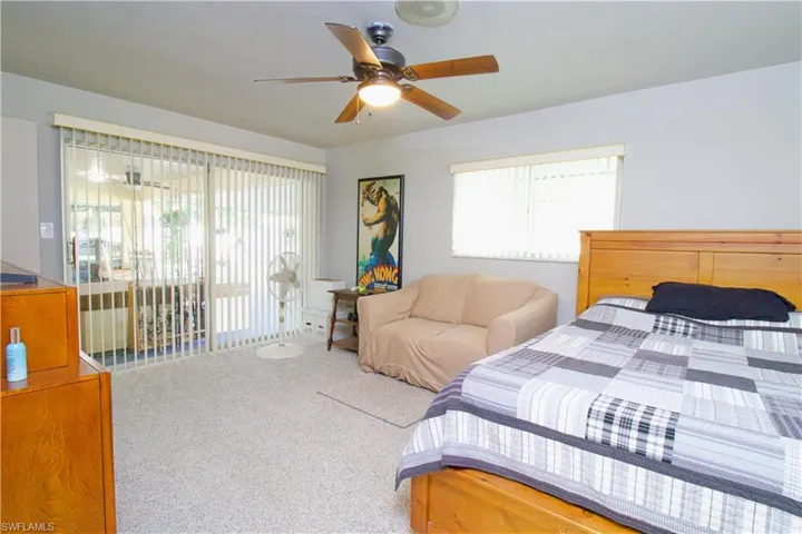 Bedroom featuring carpet floors and ceiling fan