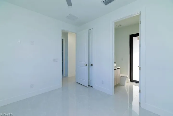 Unfurnished bedroom featuring baseboards and a ceiling fan