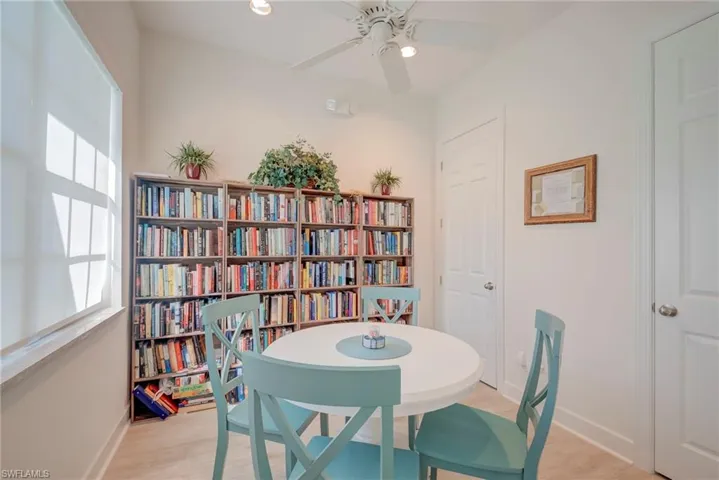 Dining room with ceiling fan, light wood-style flooring, and recessed lighting