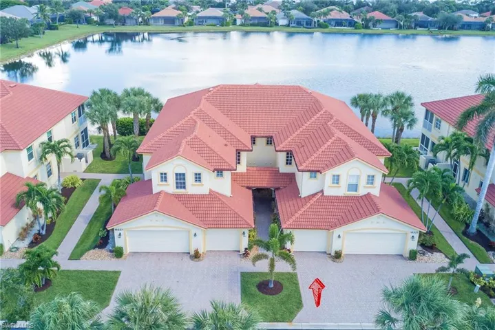 Aerial perspective of suburban area featuring a large body of water