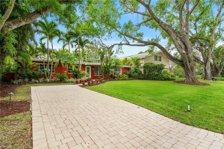 Single story home with a front lawn