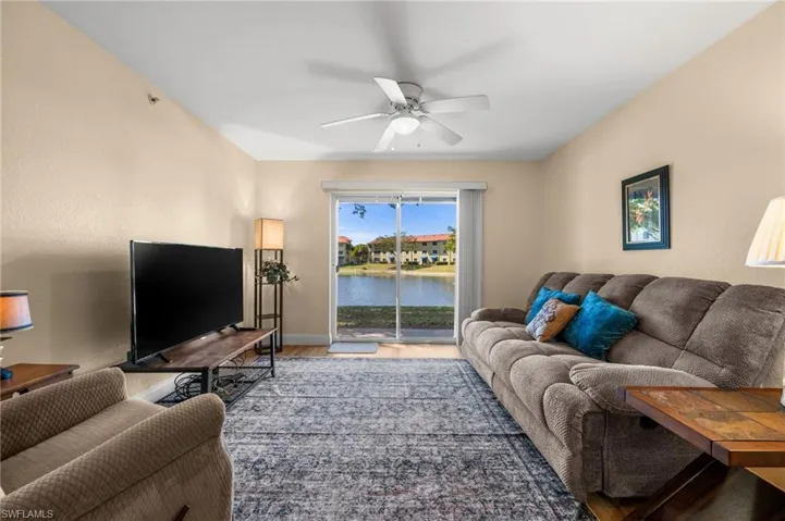 Living room featuring a ceiling fan and wood finished floors