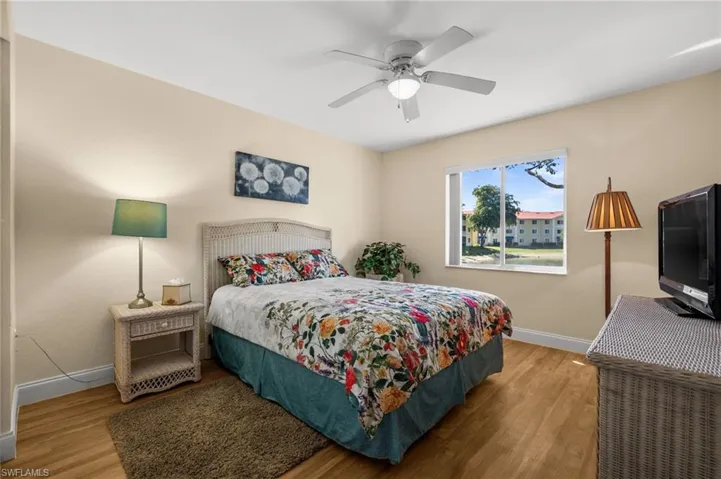 Bedroom featuring light wood-type flooring and a ceiling fan